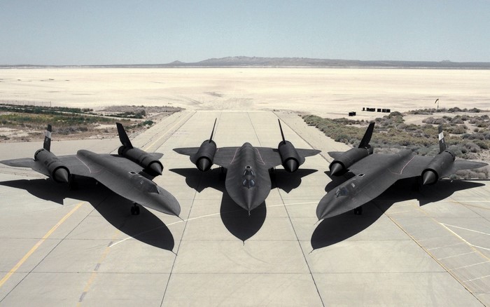 Three Lockheed SR-71 Blackbirds on a desert runway