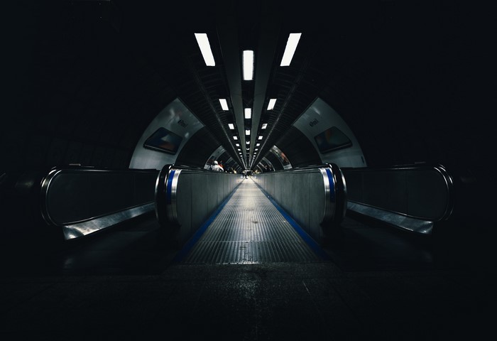 Escalator in a dark London Underground station