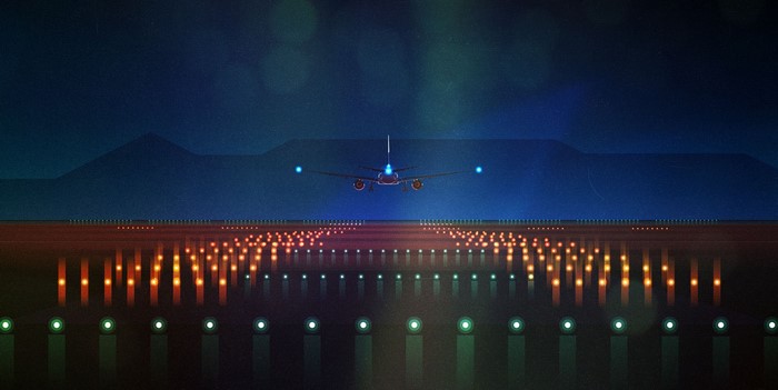Airplane on a runway at night