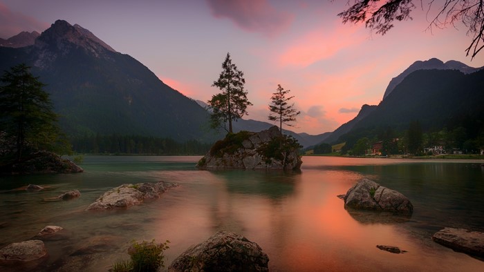 4K lake with island and mountains at sunset