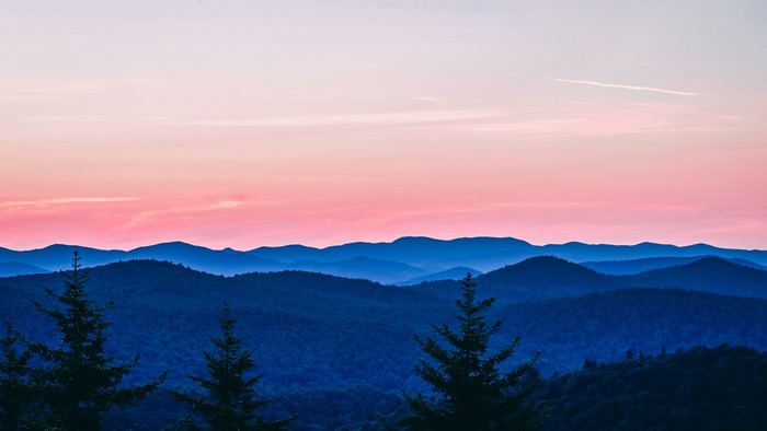 Mountain landscape at sunset with trees