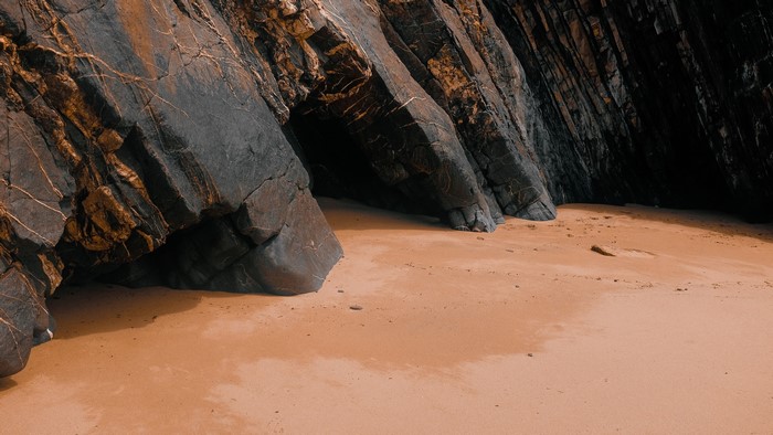 4K sand and rocks on a beach