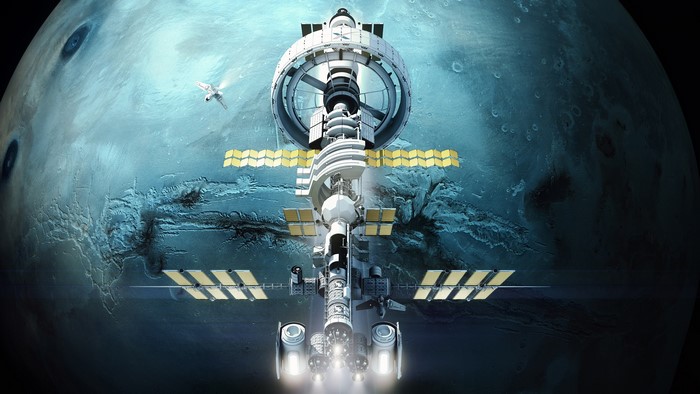 Futuristic space station orbiting a cyan planet