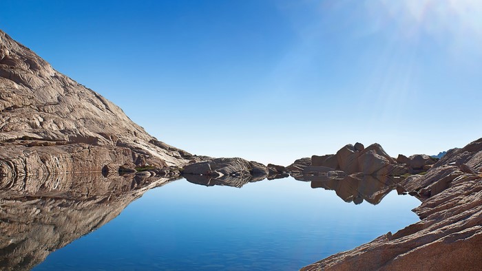 Rocky mountain lake under a clear blue sky