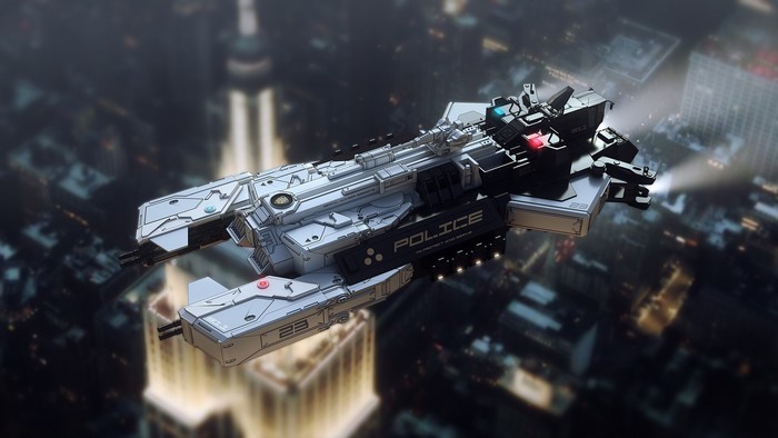 Futuristic police spaceship flying over a city