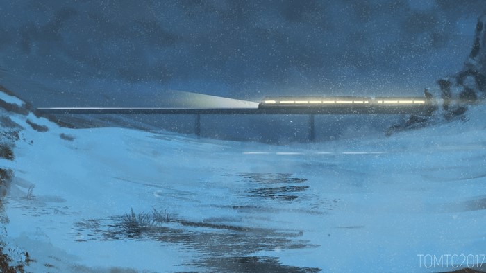 Winter train crossing a bridge at night