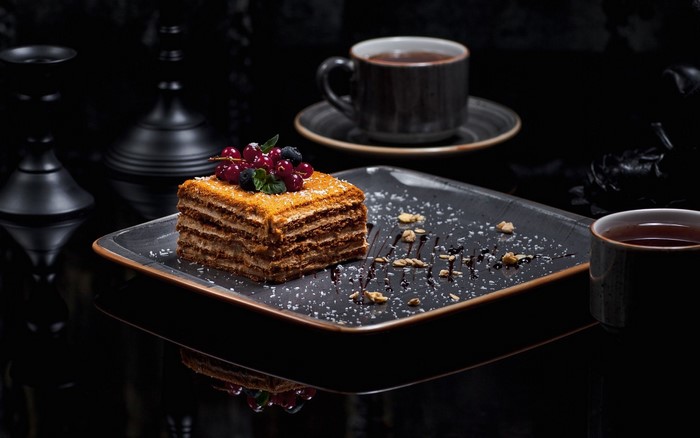 Layered cake with berries and tea