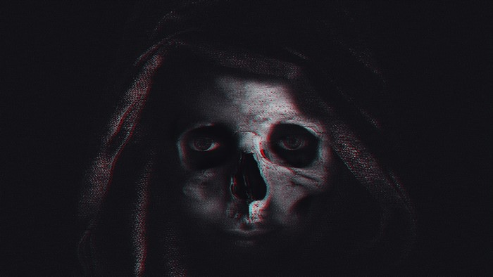 Spooky skull in a dark hood