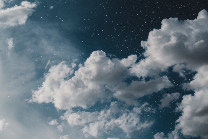 Clouds and stars in the night sky