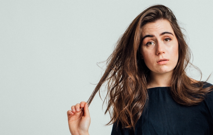 Dodie with long brown hair