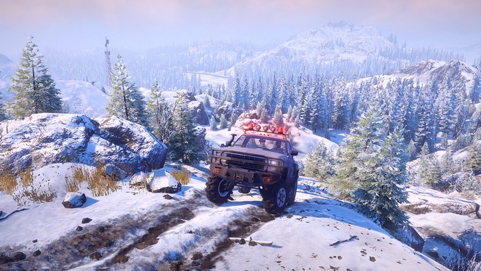 SnowRunner off-road truck driving on a snowy mountain