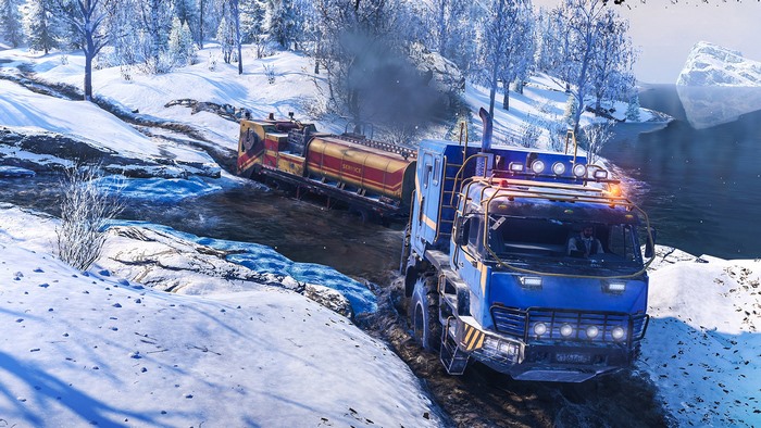 SnowRunner truck towing a train through a snowy landscape