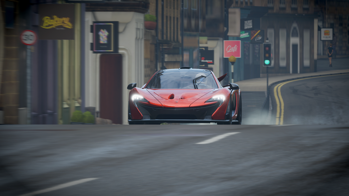 McLaren P1 driving on a wet street in Forza Horizon 4