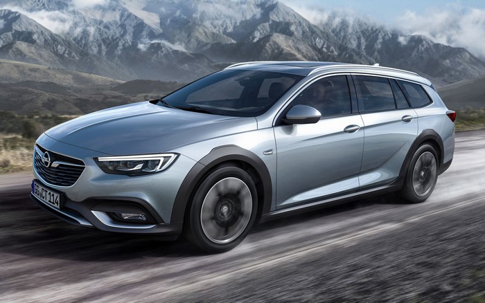Silver Opel Insignia Country Tourer driving on a road