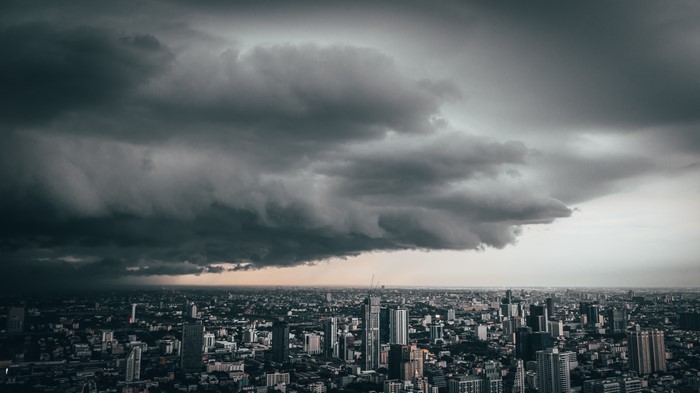 4K cityscape under stormy clouds