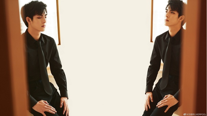 Wang Hao Xuan in a black shirt and tie