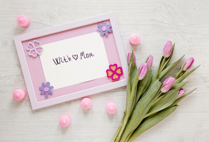 Pink tulips and a framed note for Mom