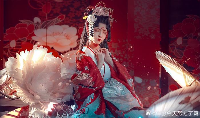 Woman in traditional Japanese red and white kimono cosplay