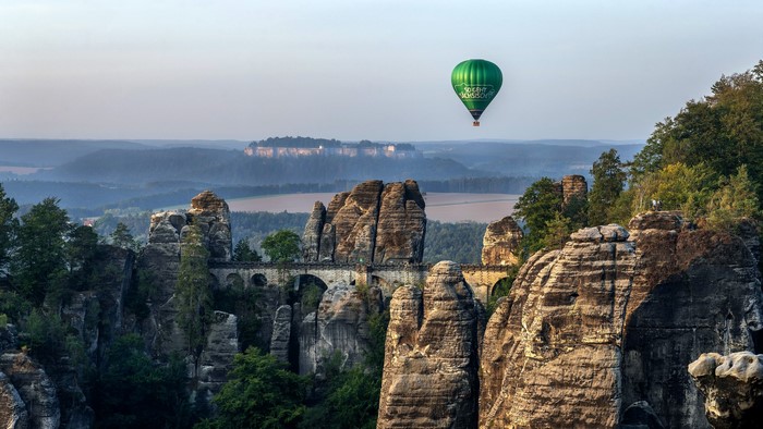 Hot air balloon over Bastei Bridge in Saxon Switzerland