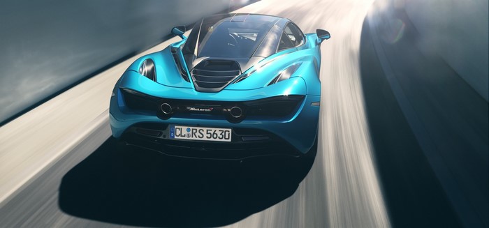 Cyan McLaren 720S driving on a road