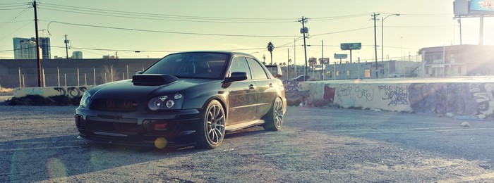 Black Subaru Impreza WRX STI Spec-D in urban setting