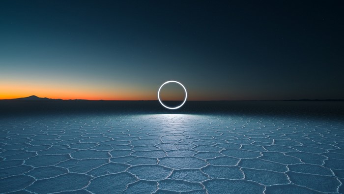 Light painting circle on salt flats at sunset