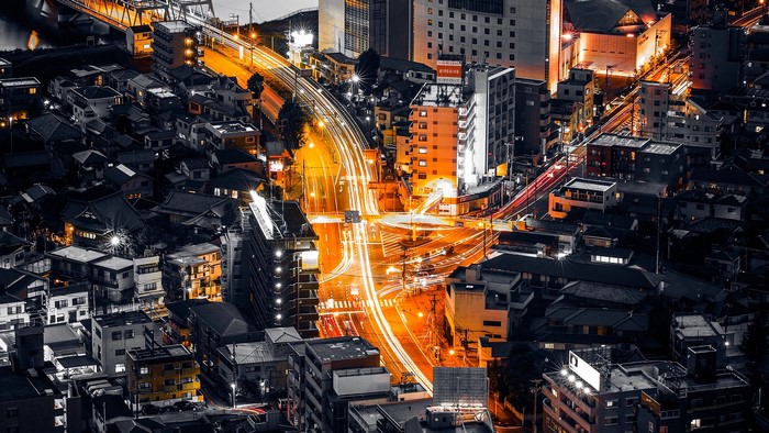 Nighttime cityscape with light trails in Japan