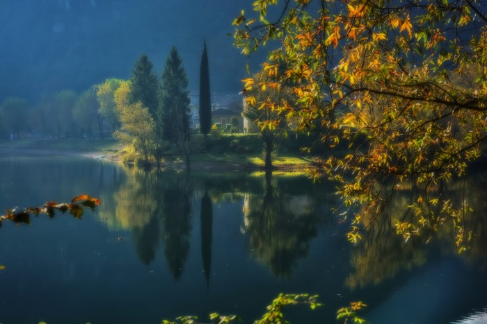 Lake and trees in Italy during fall