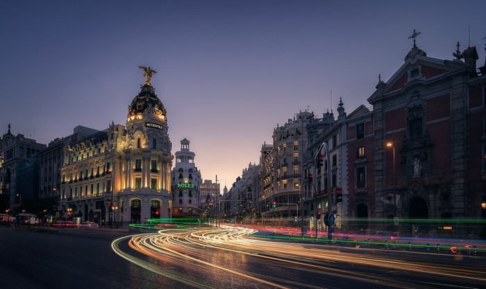 Madrid cityscape with light trails at dusk