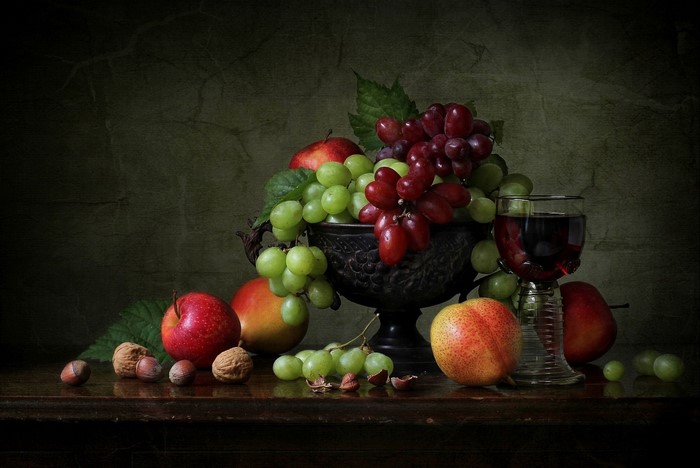 Still life with grapes, apples, nuts, and wine