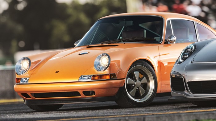 Orange Porsche 911 and silver Porsche