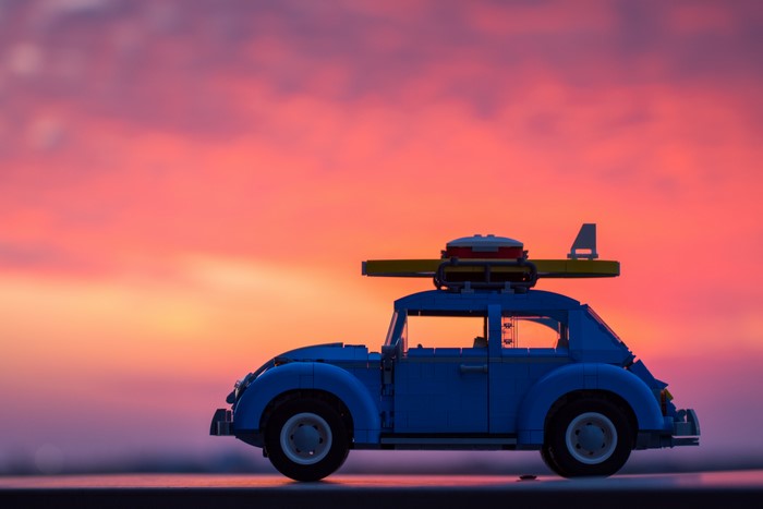 LEGO Volkswagen Beetle with surfboard at sunset
