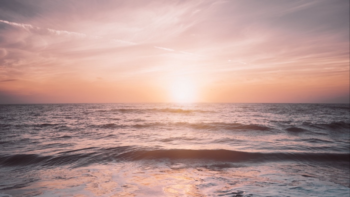 Sunrise over the ocean horizon 4K