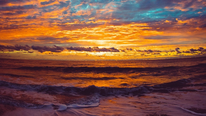 Sunrise over the sea with waves