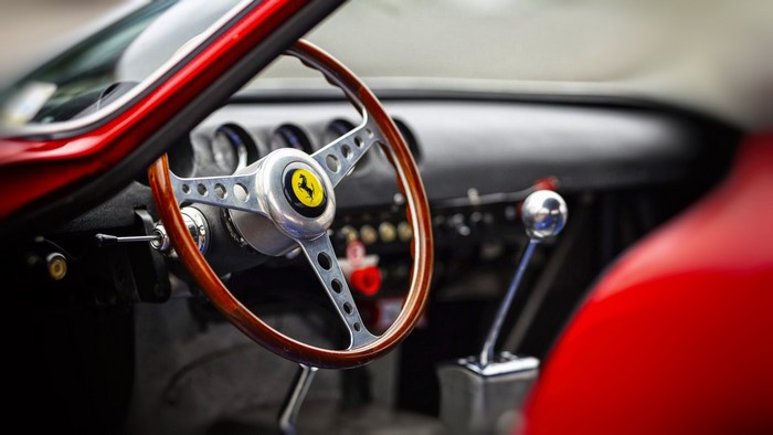 Ferrari car interior with steering wheel and gear stick
