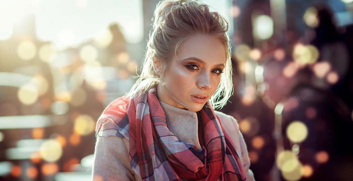 Woman with blonde hair and scarf