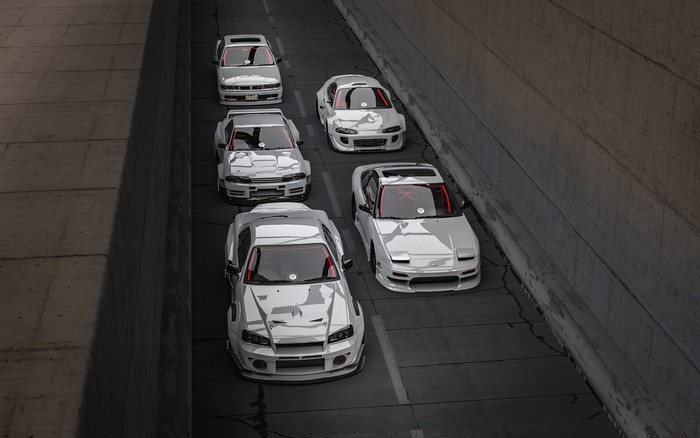 Group of modified Japanese sports cars in a tunnel