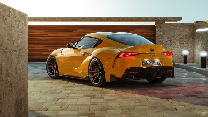Yellow Toyota Supra A90 parked in a modern driveway