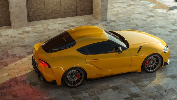 Yellow Toyota Supra A90 from a high angle