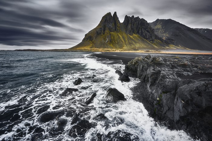 Jagged mountains and black sand beach in Iceland