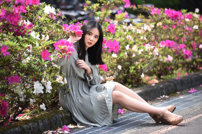 Asian Woman in Dress Among Vibrant Flowers