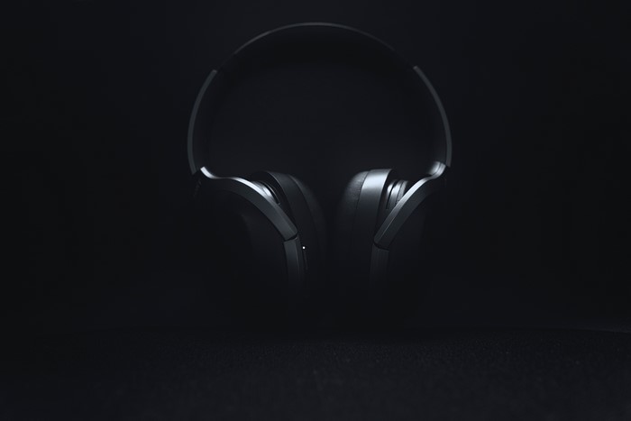 Sony WH-1000XM2 headphones on dark background
