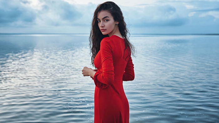 Woman in Red Dress by the Water
