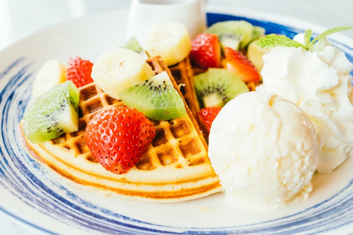 Waffle with Fruit, Ice Cream, and Whipped Cream