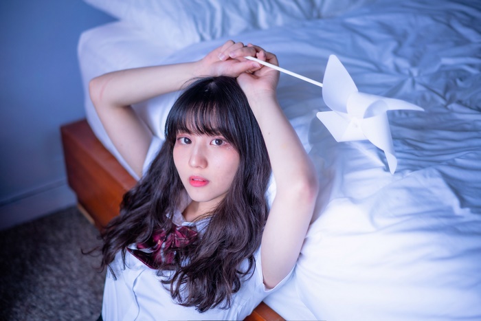 Asian Woman with Black Hair Holding a Pinwheel
