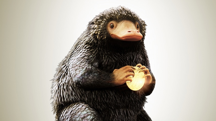 Niffler holding a golden object from Fantastic Beasts 4K