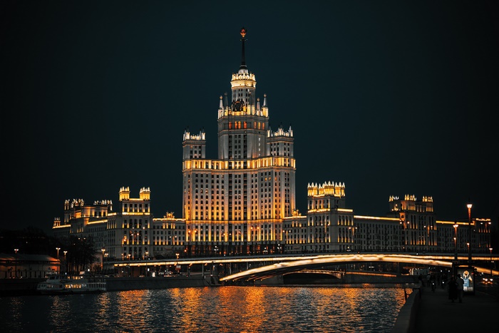 Stalinist skyscraper on the Moskva River at night