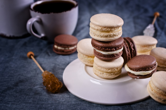 Macarons and Coffee on a Blue Tablecloth