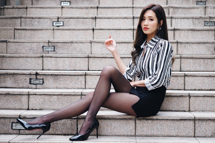 Asian Model Wearing Striped Blouse and Skirt 4K
