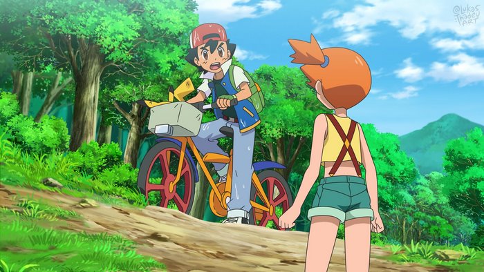Ash and Misty on a bike in a forest